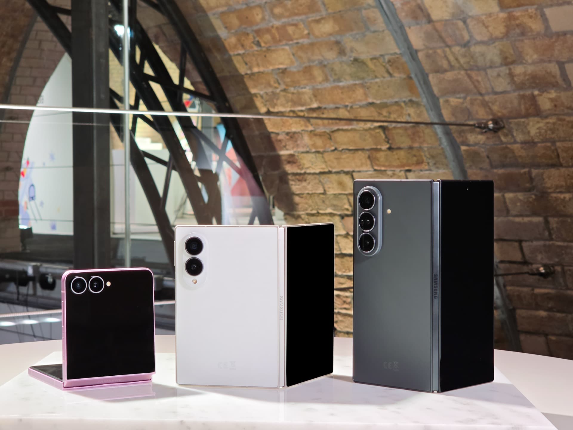 Galaxy Z Flip8, Z Fold8 and Z Fold8 Ultra standing together at the Unpacked booth